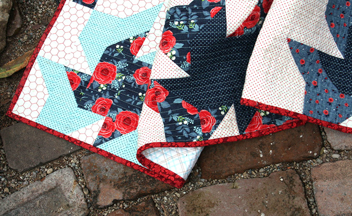 Scrappier Double Pinwheel quilt binding edges