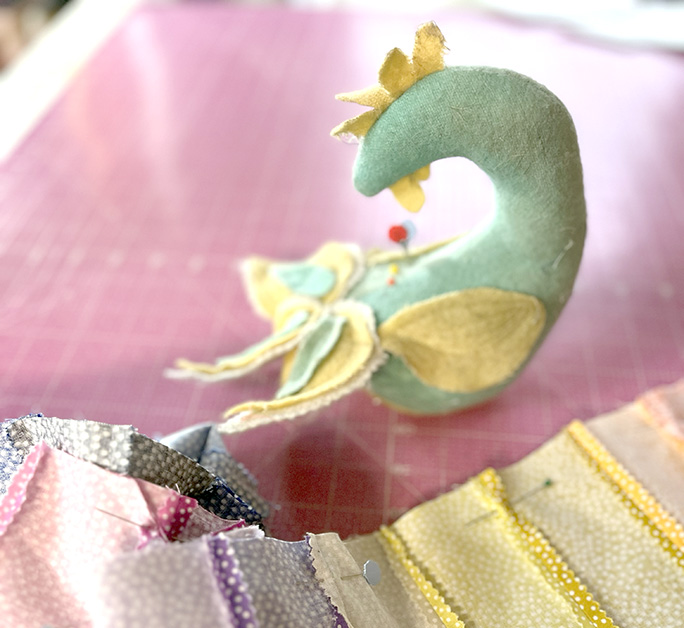 I have pinned the Jelly Roll Scarf and it is ready to sew. My Golden Hen makes pinning easy.