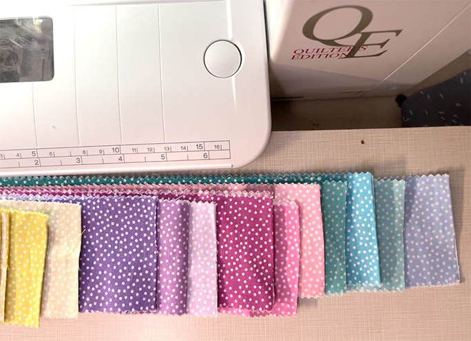 I am using the Michael Miller's Garden Pindot Jelly Roll here the precut is unrolled and in front of my sewing machine.