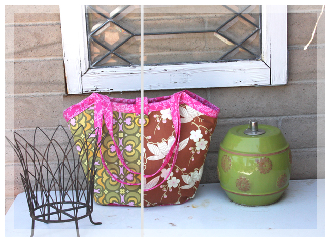 this shows two photos in one the green side and the rust red side of the Reversible Bucket Bag