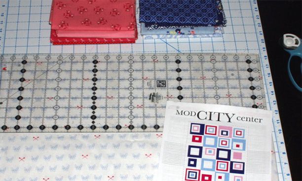 I have all my fabrics ready for cutting and organizing in  Modern City Center Quilt Along 